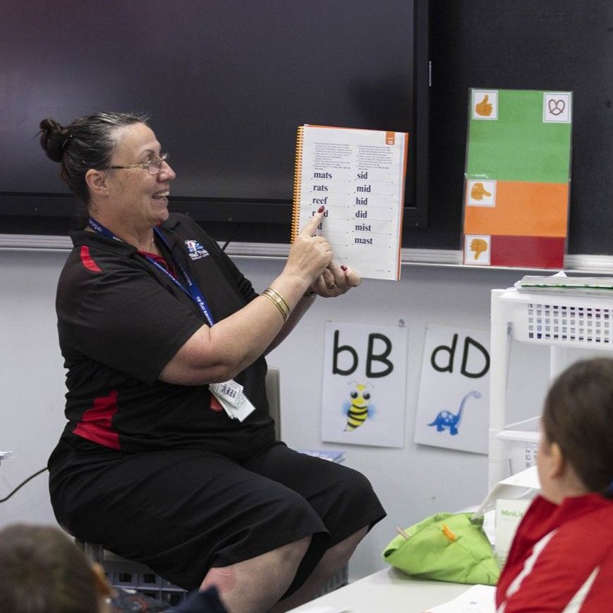 Image of teacher reading to the class using Explicit Direct Instruction methods
